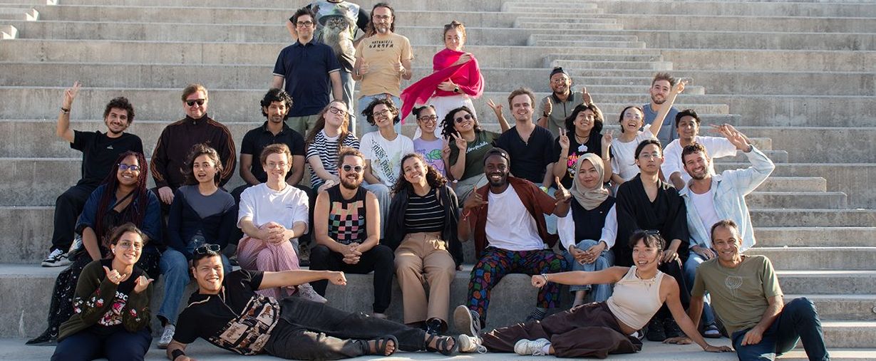 REPLAY students and staff together on outdoor steps