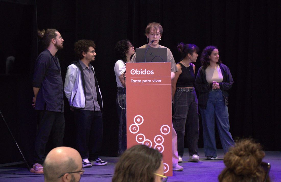 Students presenting their game on stage